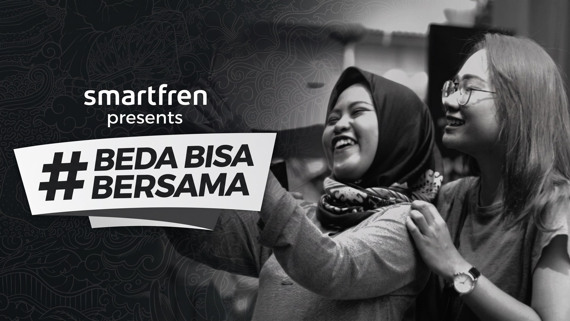 The #BedaBisaBersama title card with two women laughing together, dark monochrome